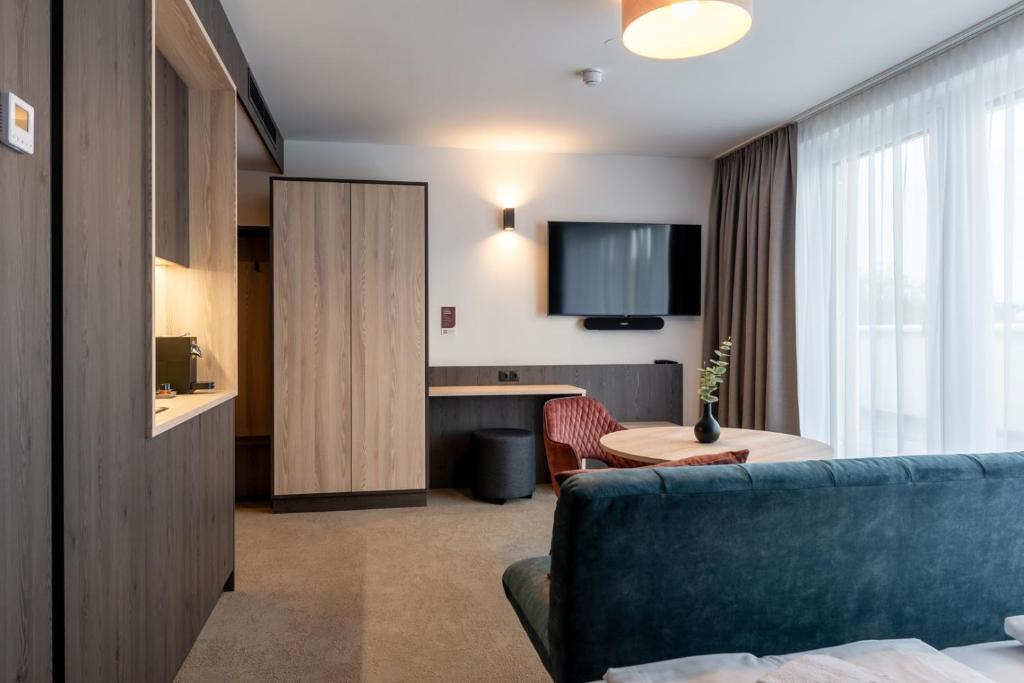 TV a/nebo společenská místnost v ubytování Hotel Novapart stay smart