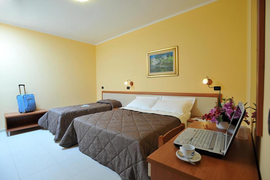 Postel nebo postele na pokoji v ubytování B&B Casa Augello