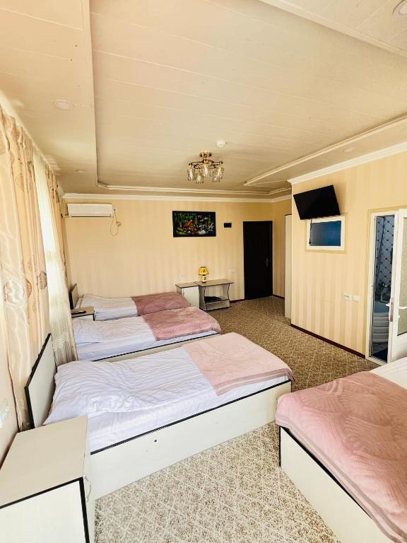 Hotel Zarafshonにあるベッド