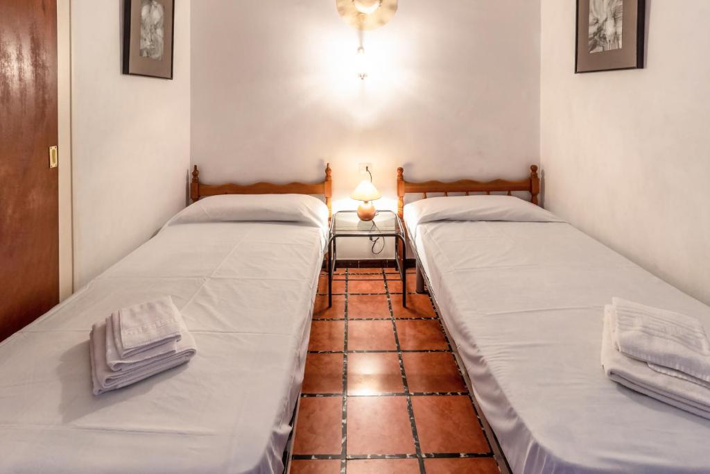 Postel nebo postele na pokoji v ubytování Port Llançà 31 - apartamento con vistas al mar