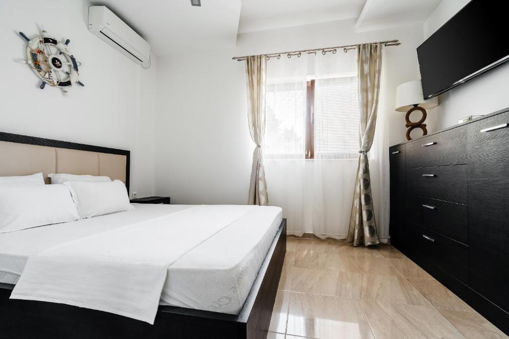 Postel nebo postele na pokoji v ubytování Przno Apartments by In Property