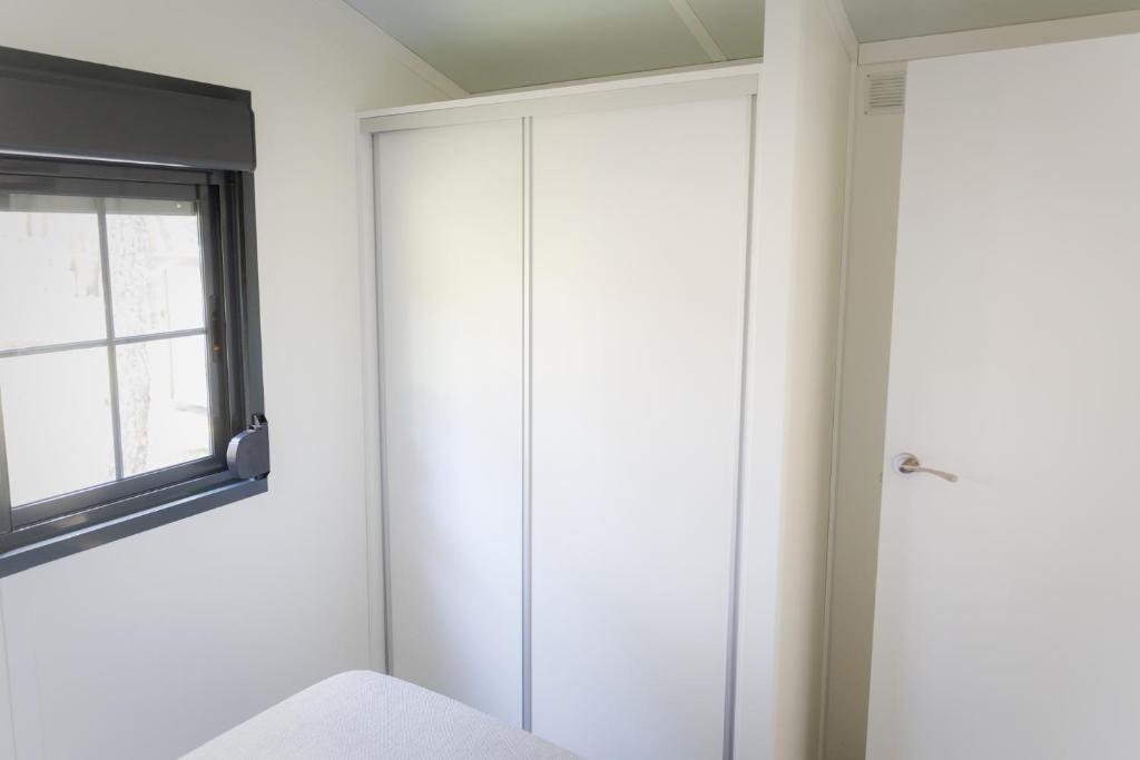 Postel nebo postele na pokoji v ubytování Camping Urbion