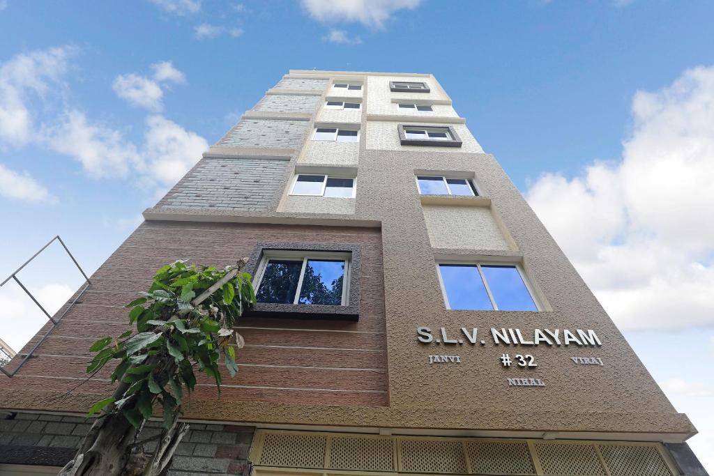 un edificio alto con las palabras silja milayan en él en 49996 JJ Comforts en Bangalore