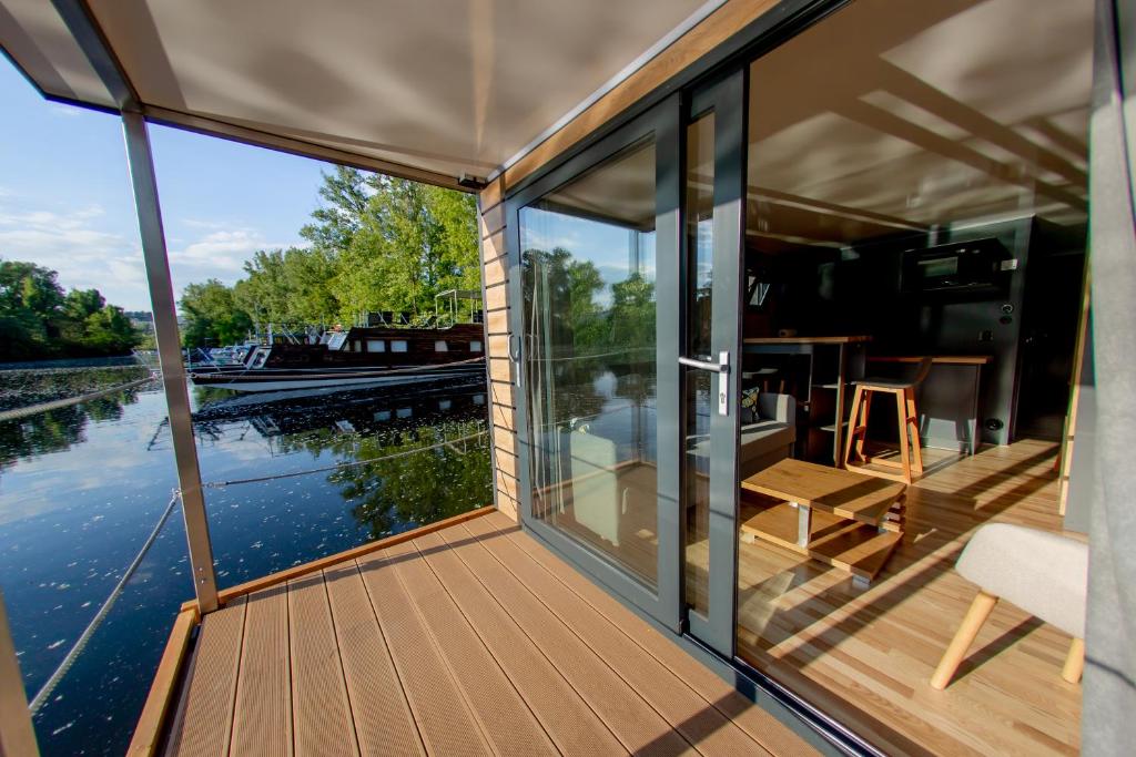a view from the inside of a boat with a deck at Prague Bay Houseboats in Prague