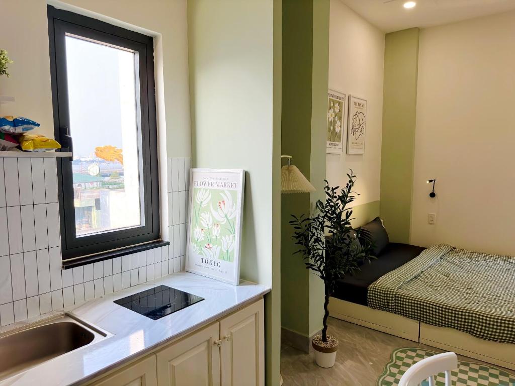 Postel nebo postele na pokoji v ubytování Corgi House Danang