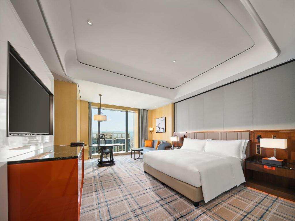 Postel nebo postele na pokoji v ubytování Hilton Fuzhou