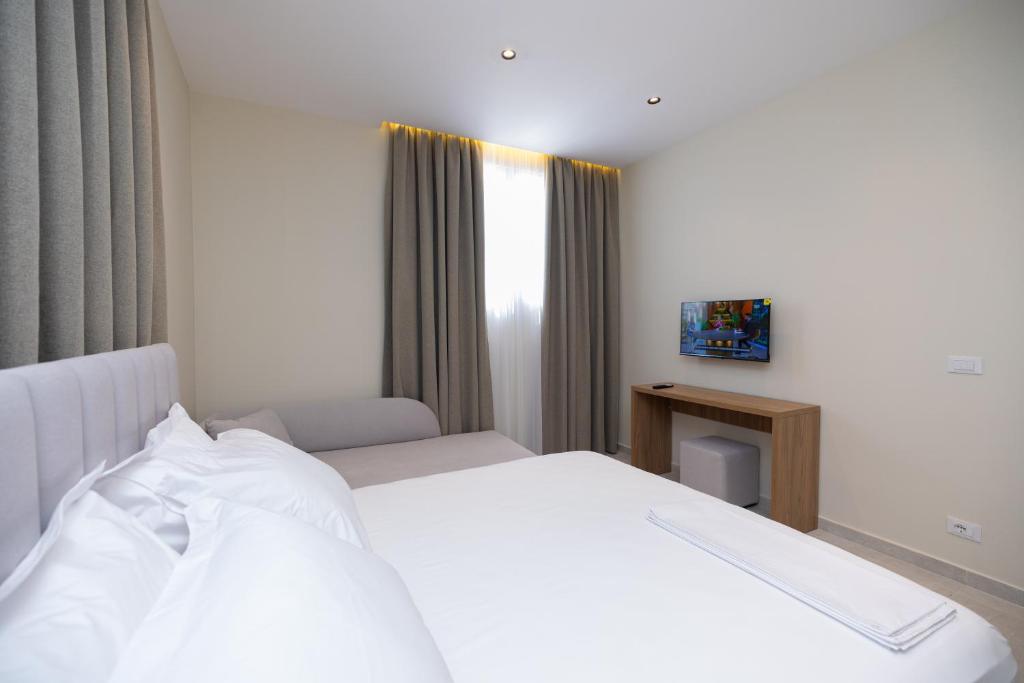 Postel nebo postele na pokoji v ubytování Hotel Aluor