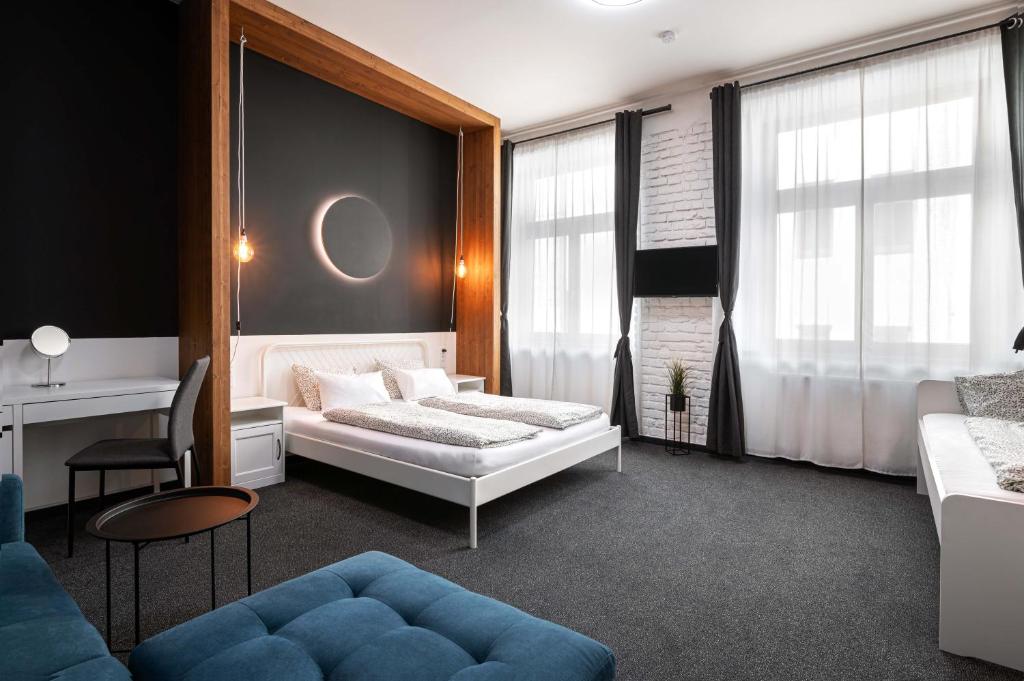 En eller flere senge i et værelse på Bohem Prague Hotel