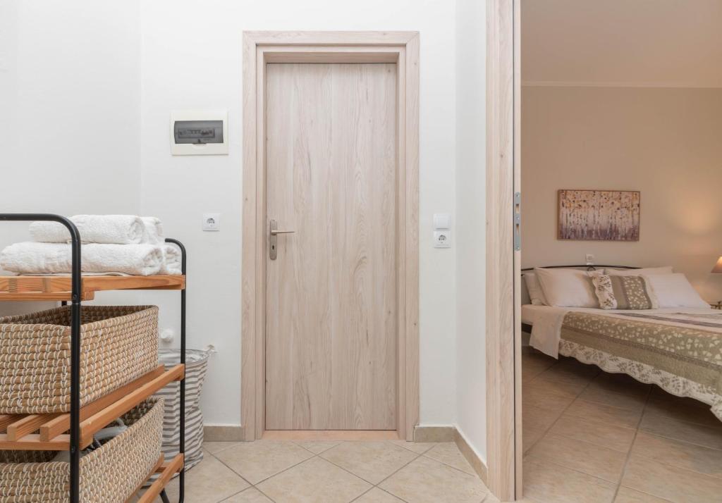 Postel nebo postele na pokoji v ubytování Dora's Apartments