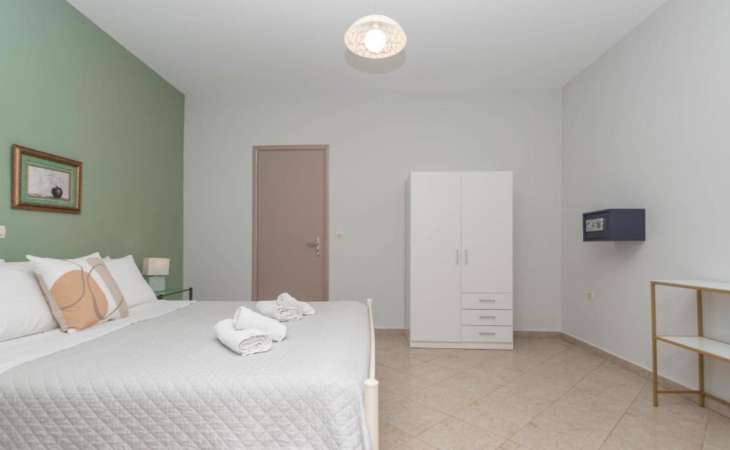 Postel nebo postele na pokoji v ubytování Dora's Apartments