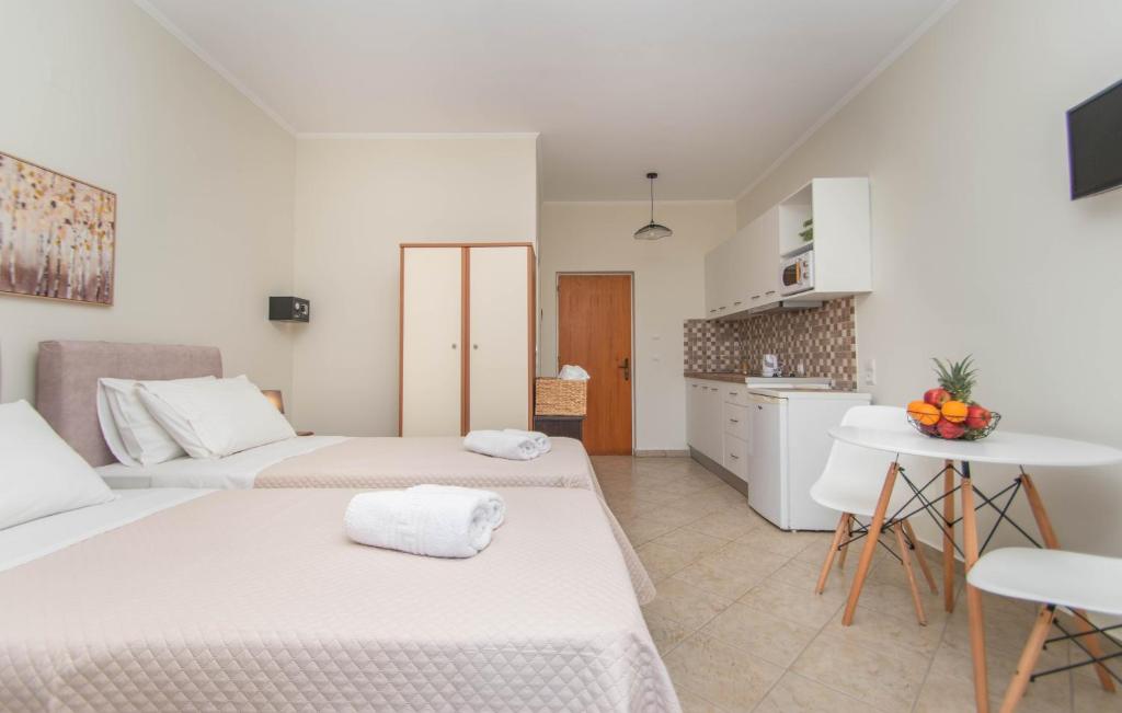 Postel nebo postele na pokoji v ubytování Dora's Apartments