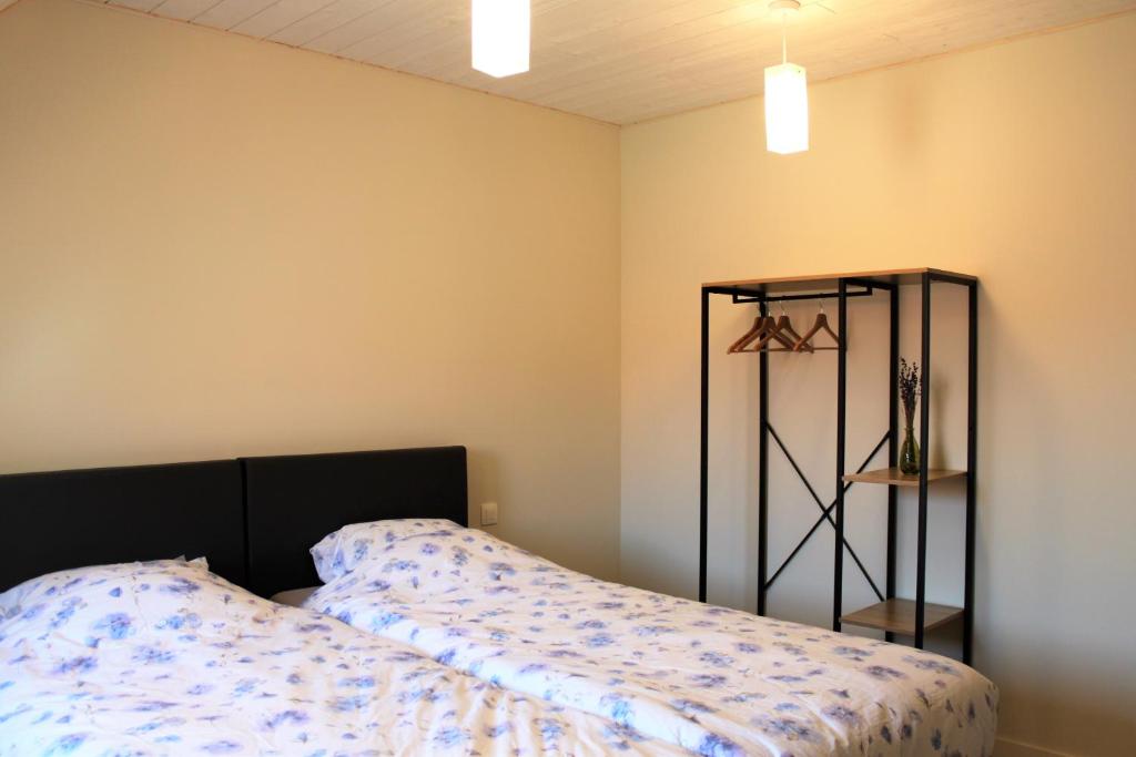 Postel nebo postele na pokoji v ubytování Bibi's Boerderij