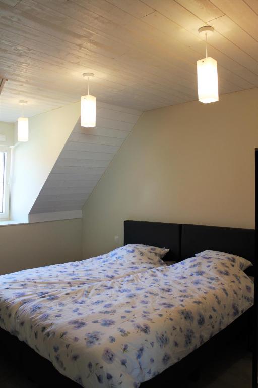 Postel nebo postele na pokoji v ubytování Bibi's Boerderij