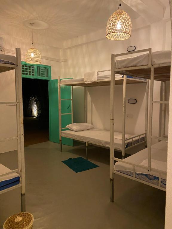 Postel nebo postele na pokoji v ubytování Fins Arugambay