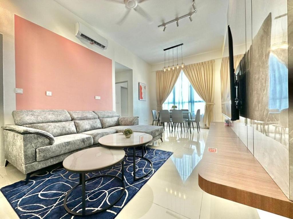 a living room with a couch and a table at Amber Cove Melaka in Malacca