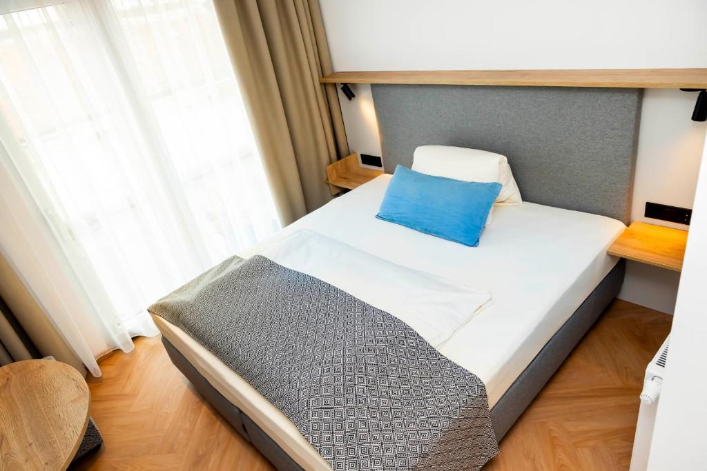 Postel nebo postele na pokoji v ubytování Zum Lenz