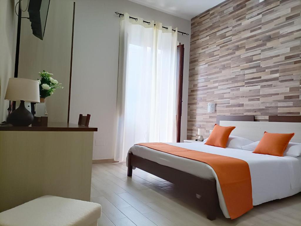 Postel nebo postele na pokoji v ubytování Domos La Corte Ghibellina