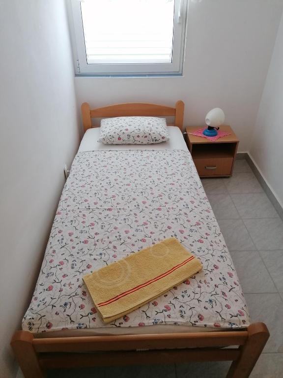 Posteľ alebo postele v izbe v ubytovaní Apartmani Marija i Josip