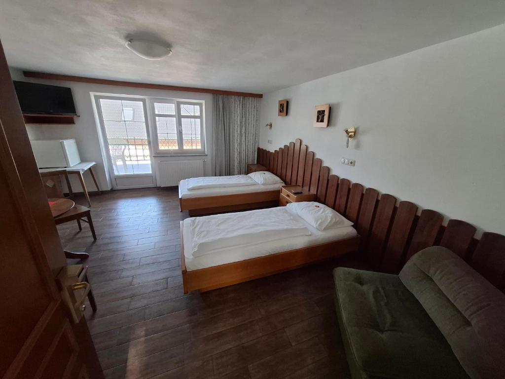Ein Bett oder Betten in einem Zimmer der Unterkunft Frühstückspension Wahl