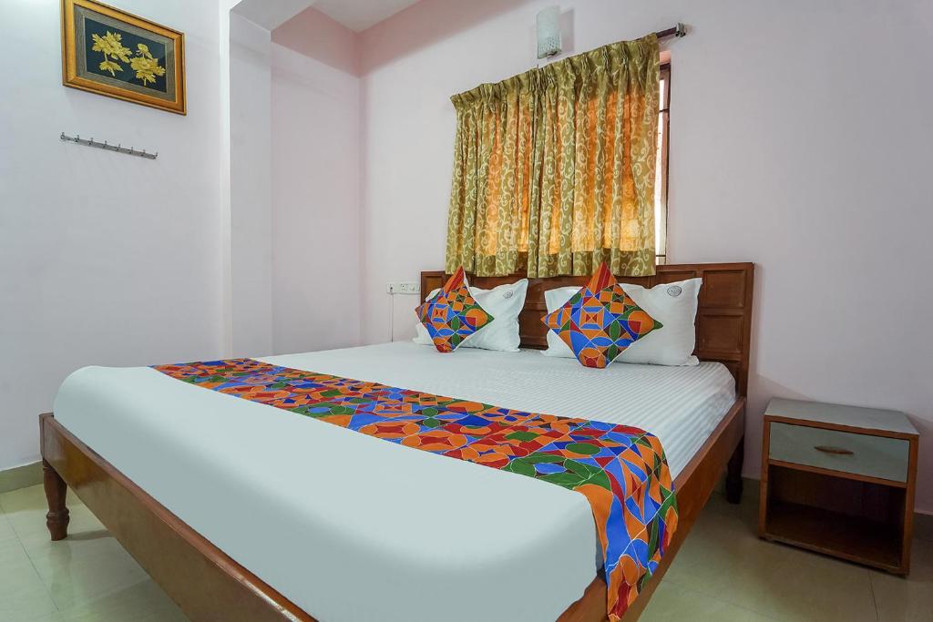Postel nebo postele na pokoji v ubytování FabHotel Terra - Nr Madras Medical Mission Hospital, Mogappair