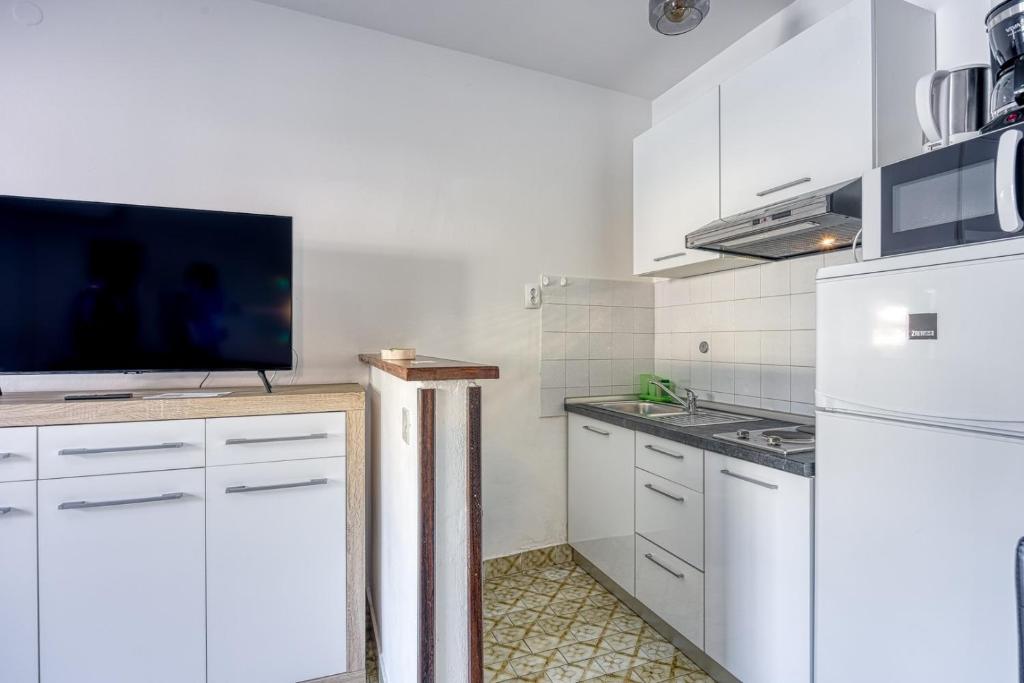 Kuchyň nebo kuchyňský kout v ubytování Apartment Riva 1001