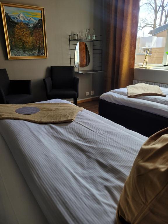 Postel nebo postele na pokoji v ubytování Arena Hotell