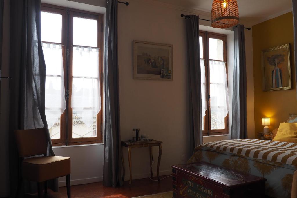 Postel nebo postele na pokoji v ubytování Chambres d'Hôtes Le relais des marmottes en Luberon