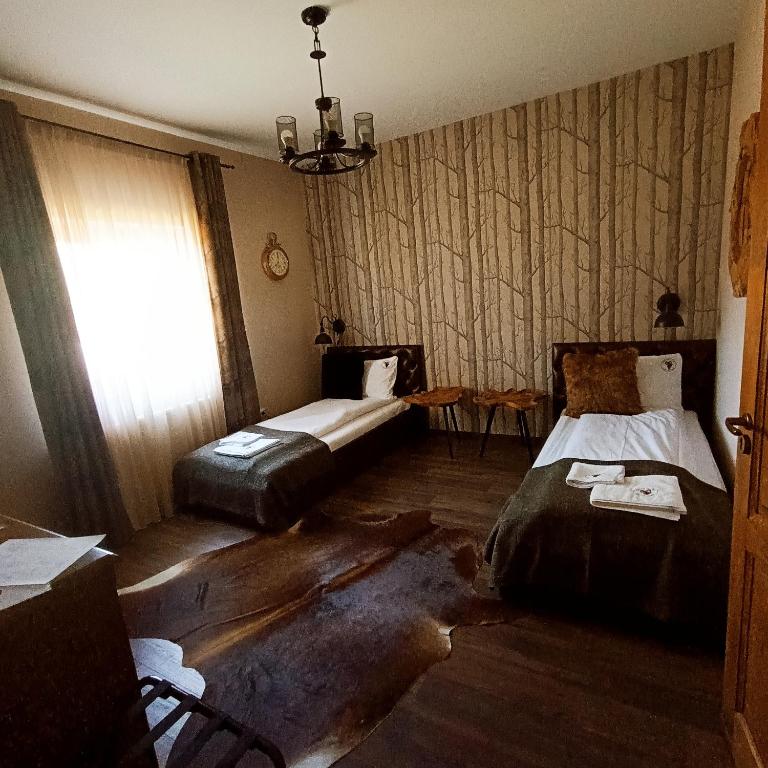 Postel nebo postele na pokoji v ubytování Tekeres-patak Fogadó