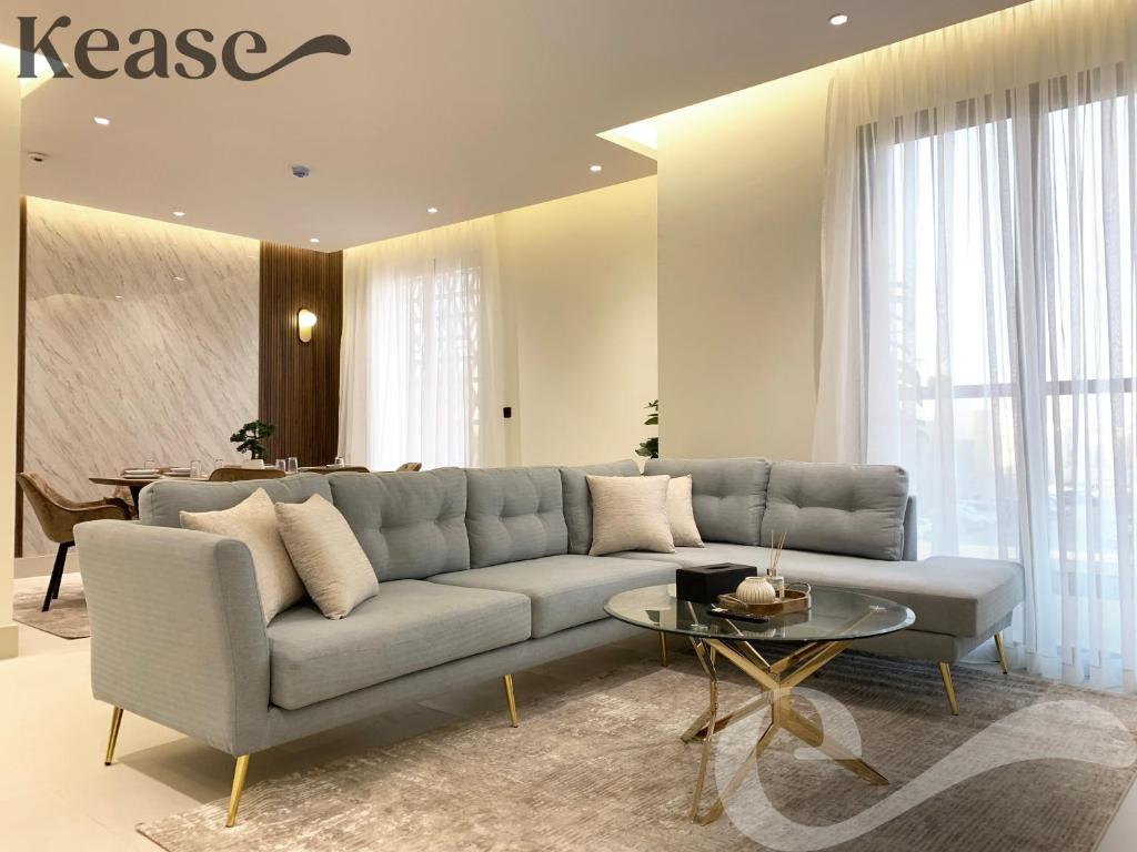a living room with a couch and a table at Kease Tawun A1-8 Royal touch Balcony GZ41 in Riyadh