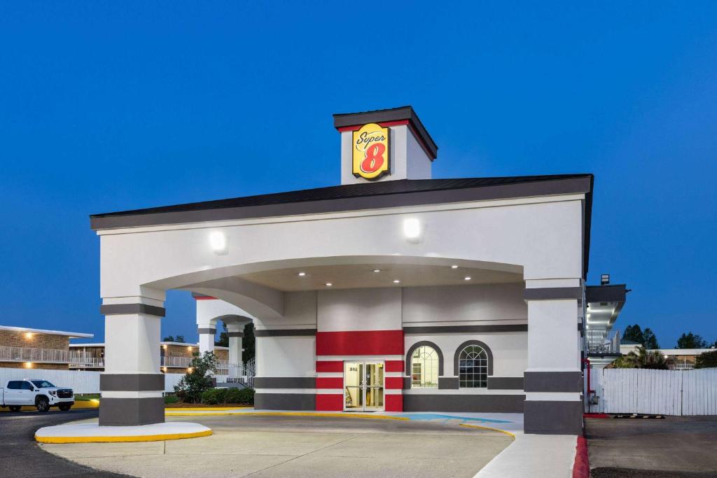 a building with a mcdonalds sign on it at Super 8 by Wyndham Baton Rouge/I-10 in Baton Rouge