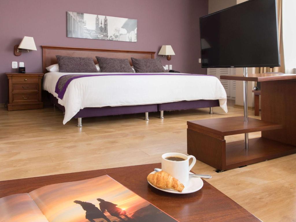 Postel nebo postele na pokoji v ubytování Mercure Alameda Quito