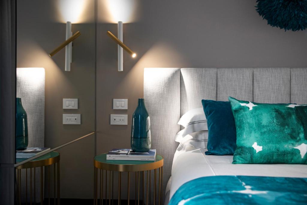 Postel nebo postele na pokoji v ubytování Hotel Byron