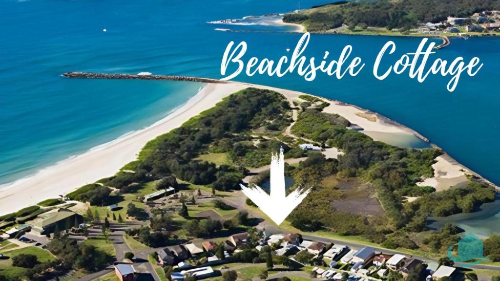an aerial view of a beachside cottage with the words beautiful cottage at Beachside Cottage at Blacksmiths in Blacksmiths