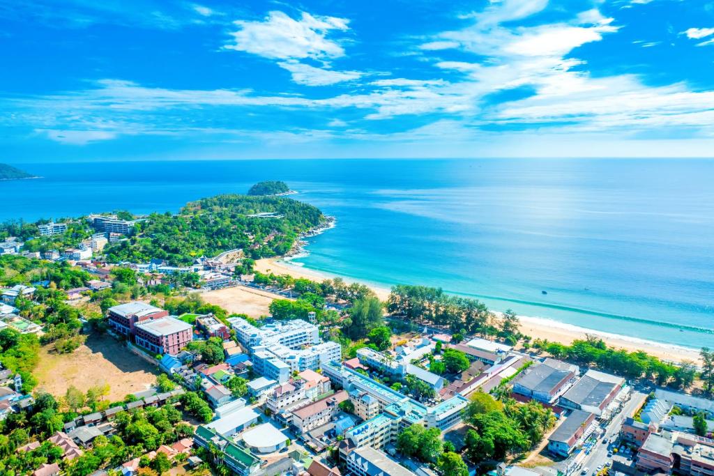 an aerial view of a city and the ocean at Karon Island Boat Boutique Hotel in Patong Beach