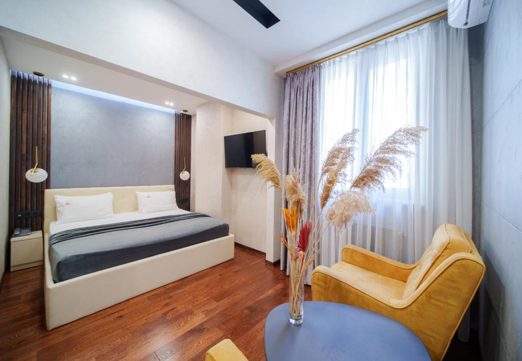 Postel nebo postele na pokoji v ubytování Arch Apart Hotel