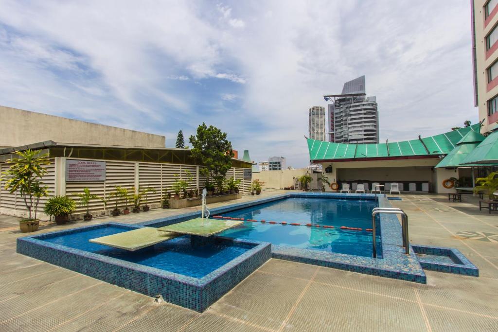 a swimming pool on top of a building at Red Rock Hotel Penang in George Town