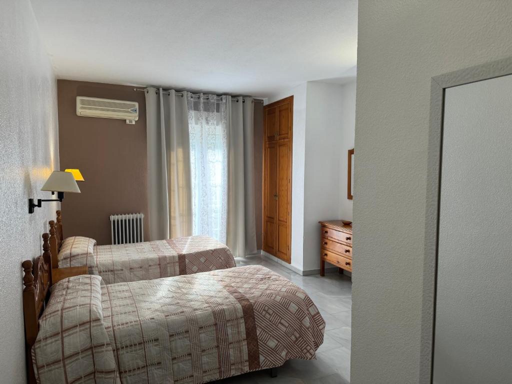 Posteľ alebo postele v izbe v ubytovaní Hotel Mirasol