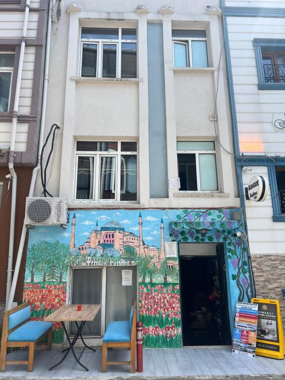 a building with a mural on the side of it at Happy Suite Boutique Hotel in Istanbul