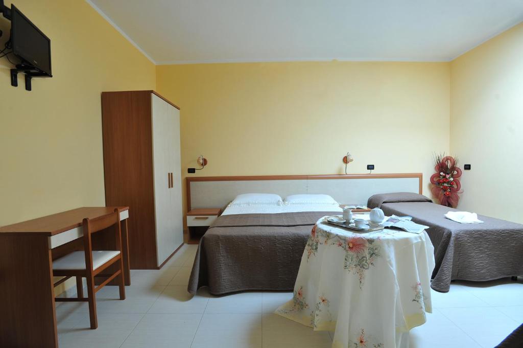 Postel nebo postele na pokoji v ubytování B&B Casa Augello