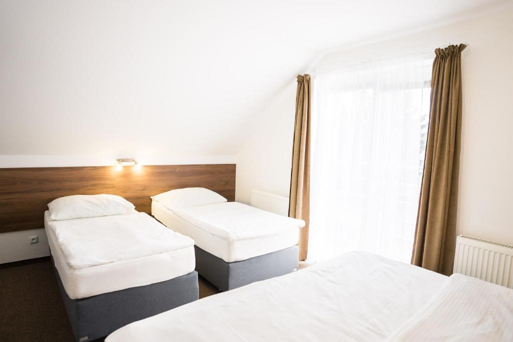 Postel nebo postele na pokoji v ubytování Apartmány Banff