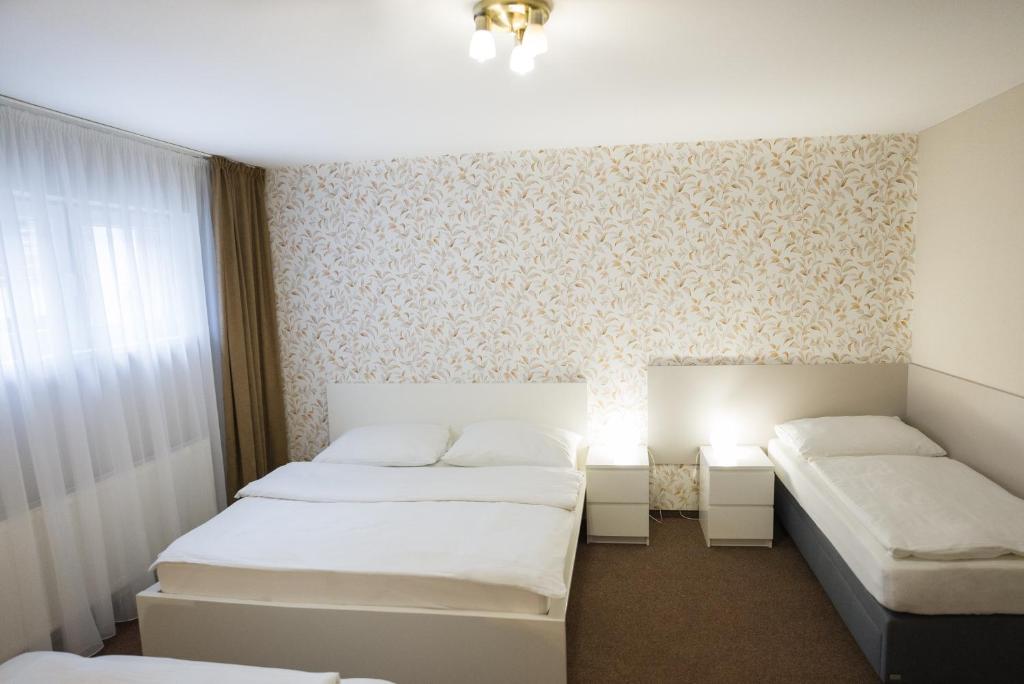 Postel nebo postele na pokoji v ubytování Apartmány Banff