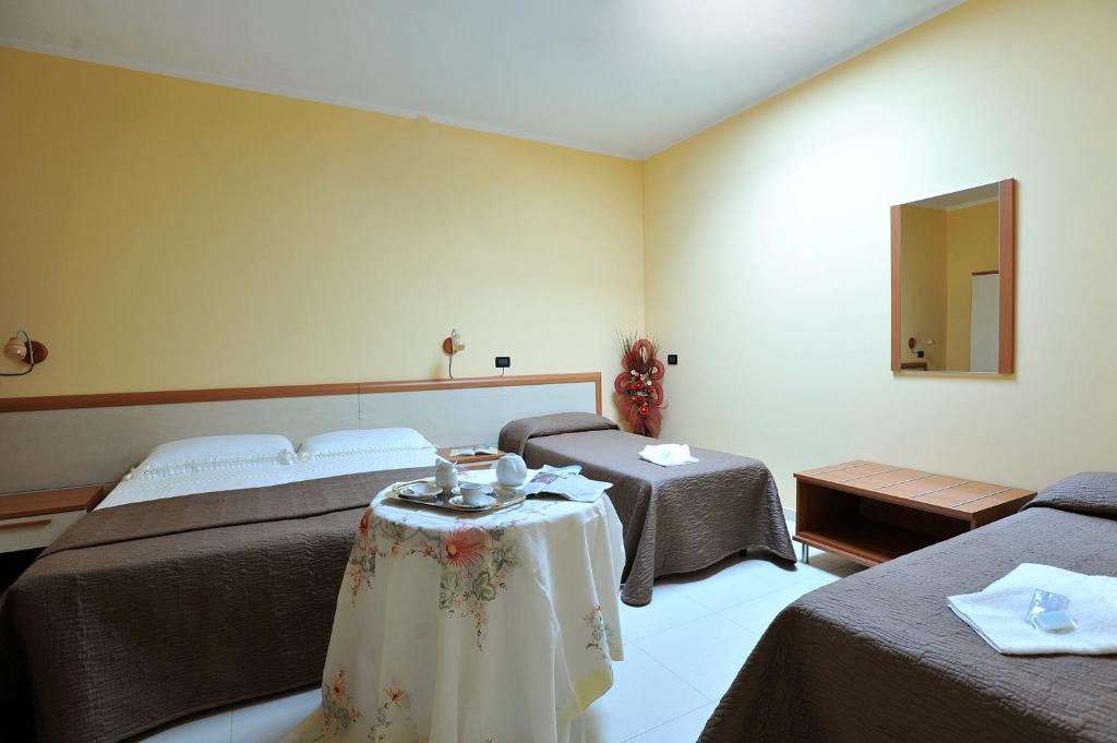 Postel nebo postele na pokoji v ubytování B&B Casa Augello