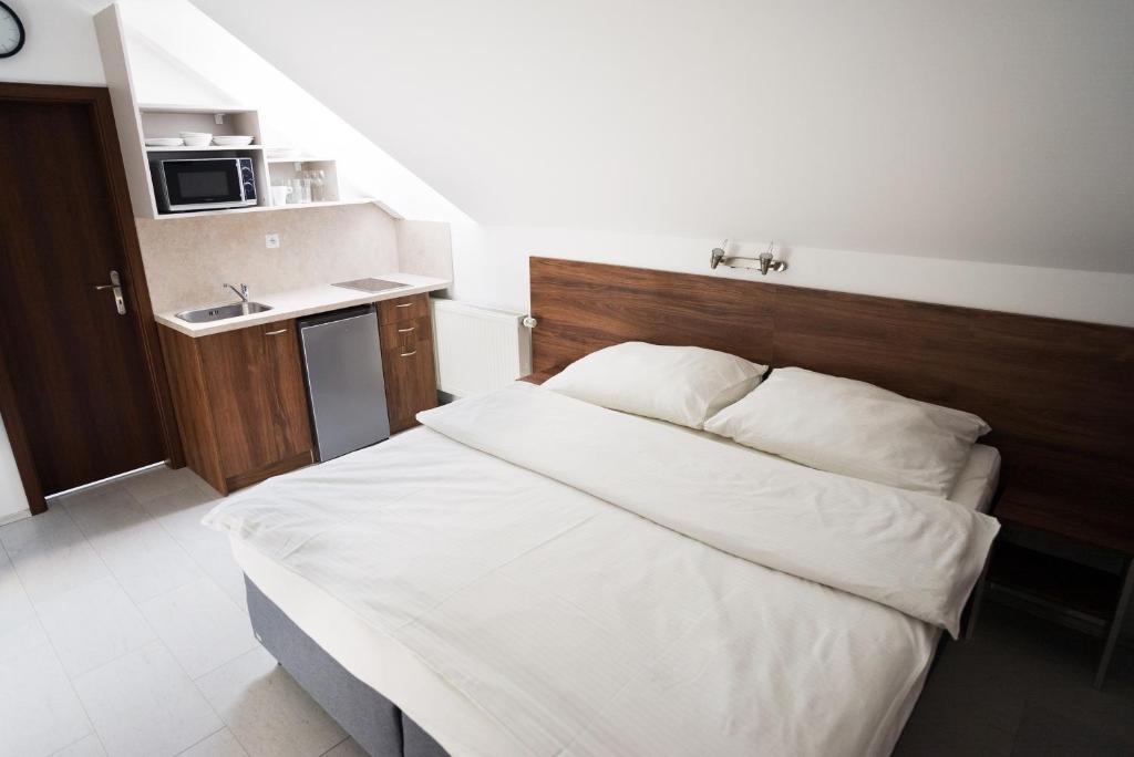 Postel nebo postele na pokoji v ubytování Apartmány Banff