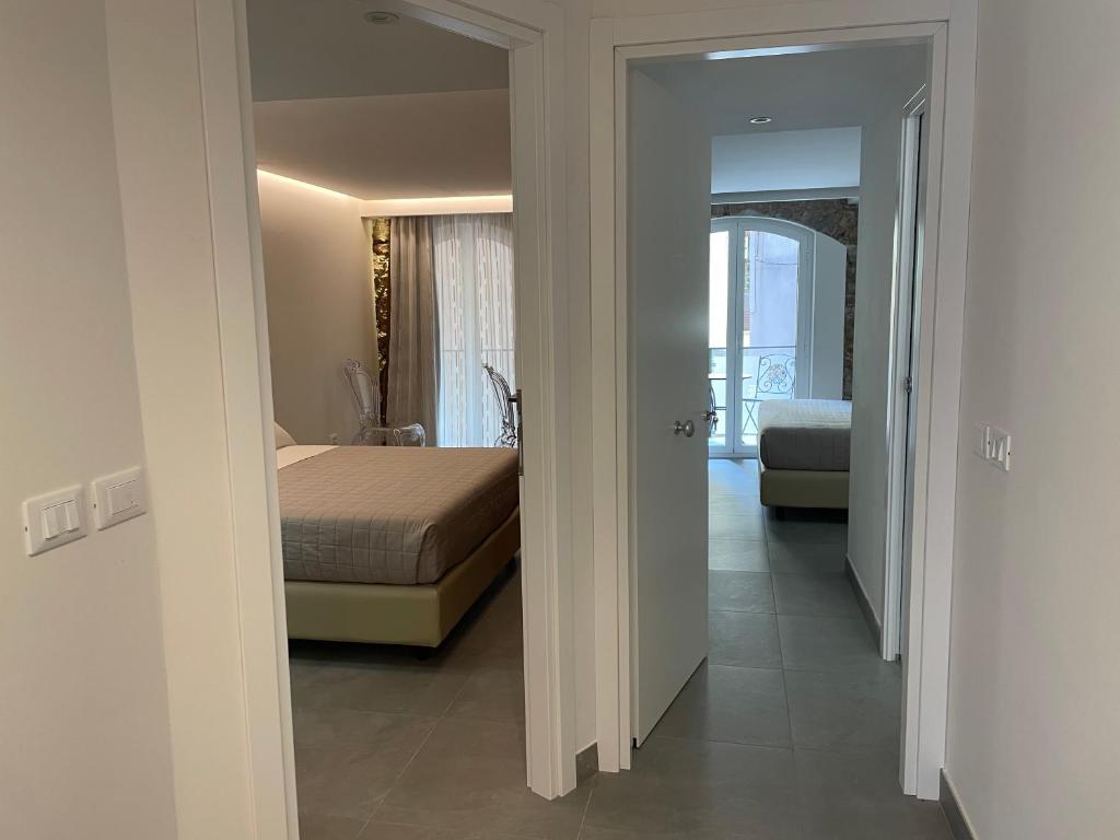 Voodi või voodid majutusasutuse Taormina charming rooms toas