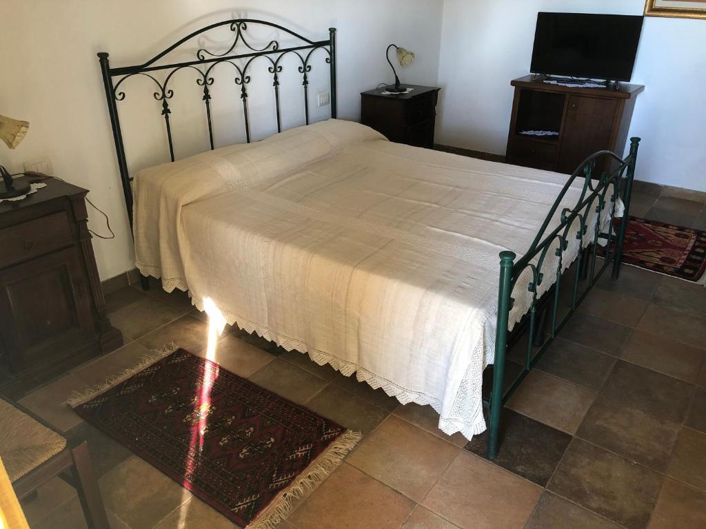 Postel nebo postele na pokoji v ubytování Agriturismo La Lucia