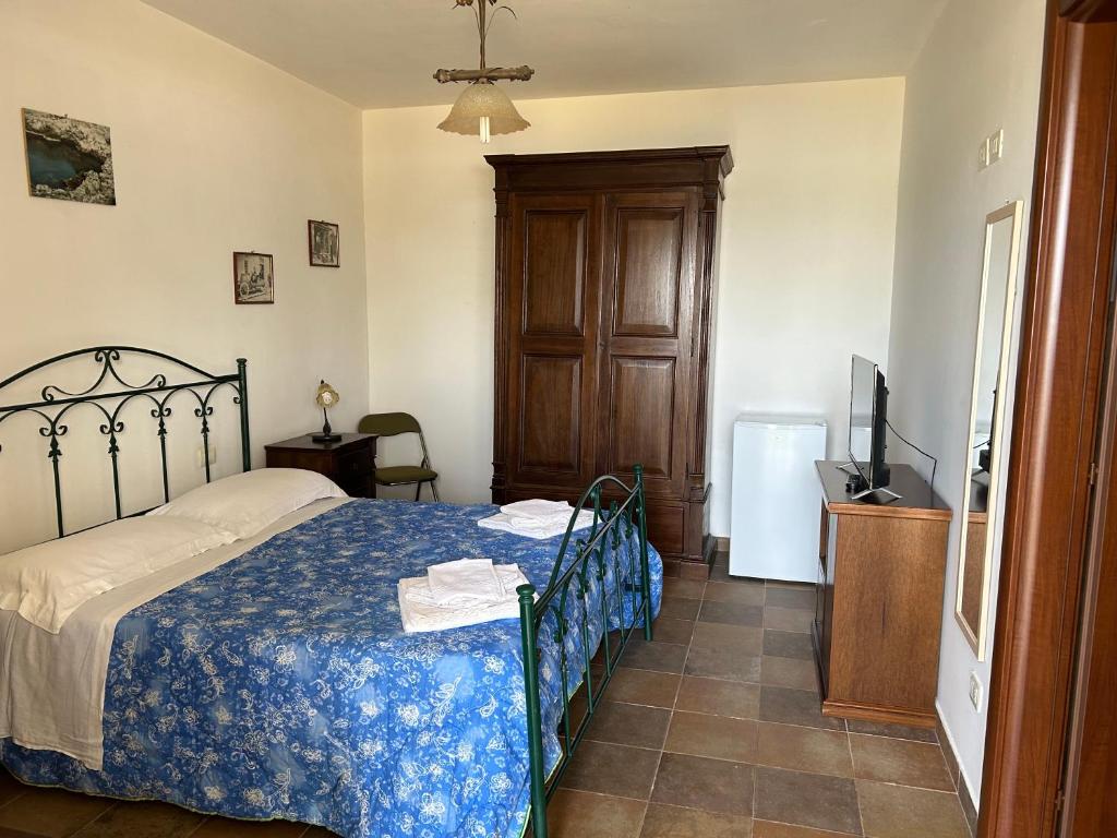 Postel nebo postele na pokoji v ubytování Agriturismo La Lucia