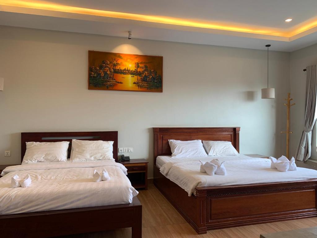 Postel nebo postele na pokoji v ubytování Nico's Hotel 2