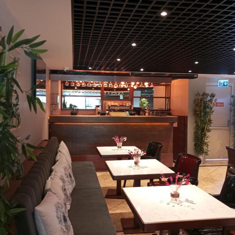a restaurant with tables and chairs and a bar at Cihangir Hotel Bosphorus in Istanbul