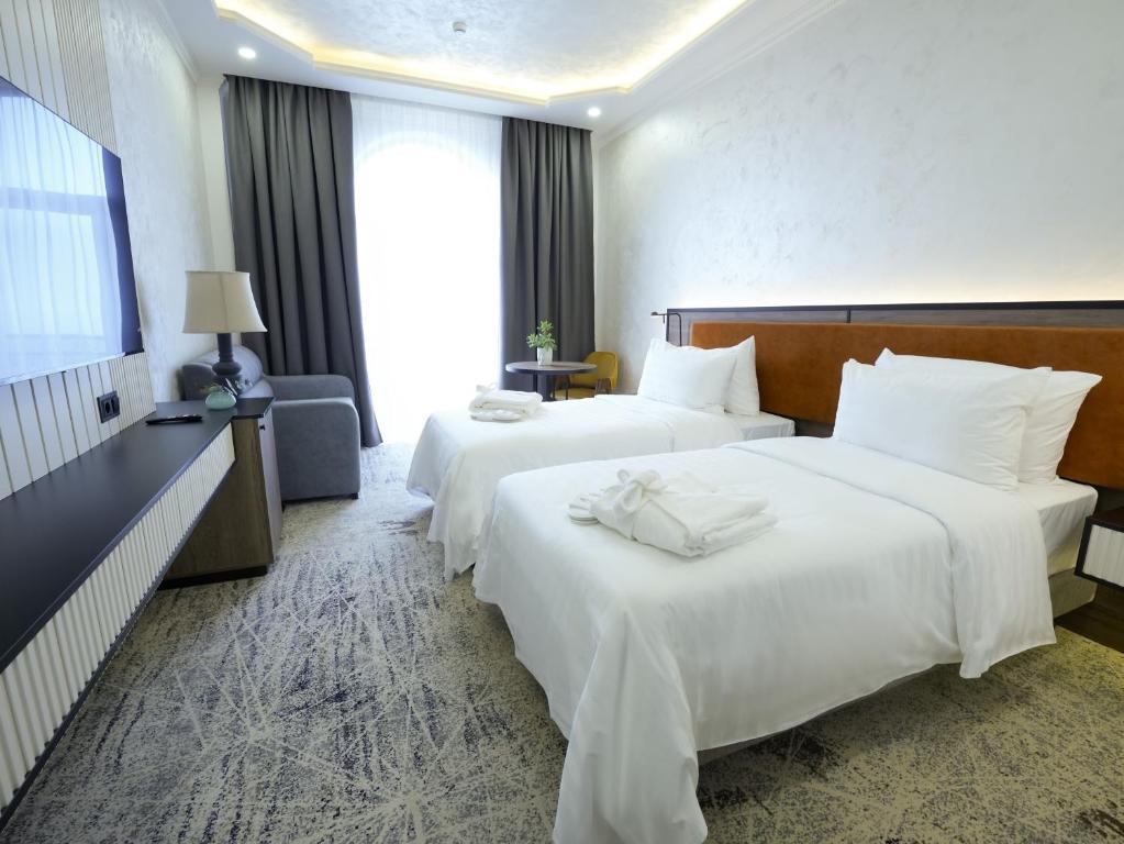 Кровать или кровати в номере Eighty Eight Deluxe Hotel & Spa