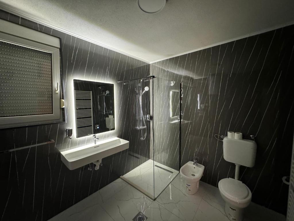 Koupelna v ubytování Hotel Villa Nadin
